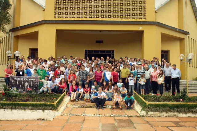 Group photograph from the 2nd Carlesso Family reunion, in Boqueirão do Leão, 2013, on the church steps.